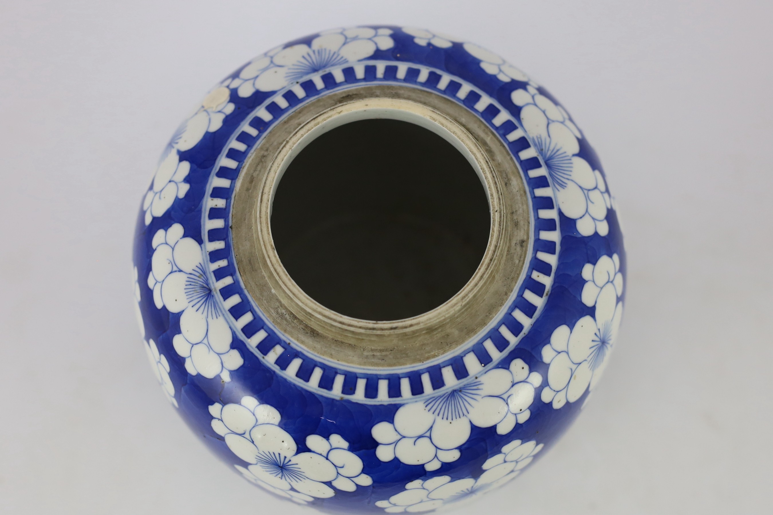 A Chinese blue and white prunus jar and cover, 19th century, 25cm high, cover associated